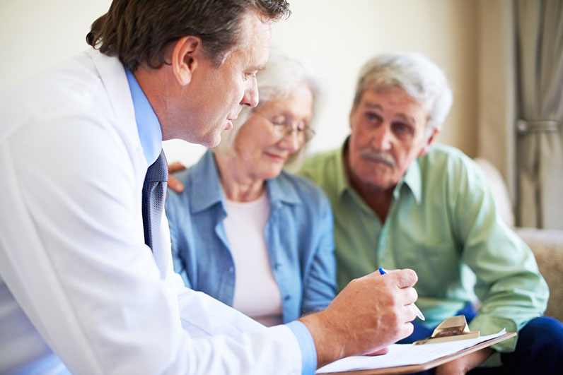 Doctor talking with a couple